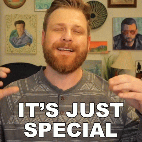 A Man With A Beard Is Smiling With The Words It 'S Just Special Behind Him GIF
