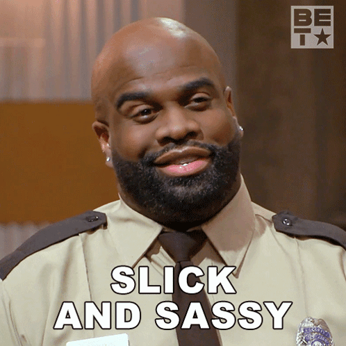 A Man With A Beard Is Smiling With The Words Slick And Sassy Behind Him GIF