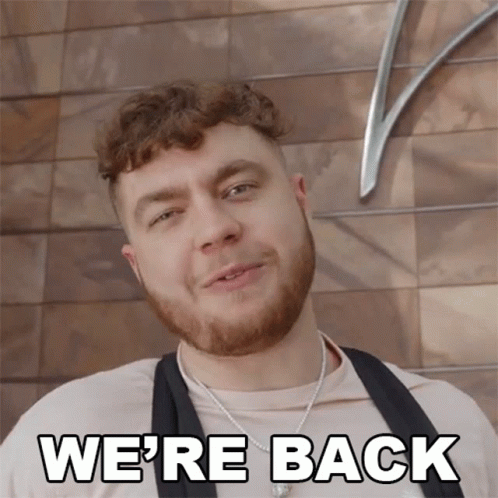 Man Smiling With Were Back Below GIF