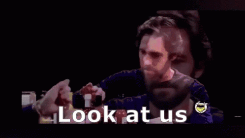 A Man With A Beard Is Smiling With The Words `` Who Woulda Thought '' Behind Him . GIF