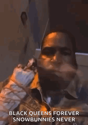 A Man With A Beard Is Smoking A Cigarette And Says `` Black Queens Forever Snowbunnies Never '' GIF