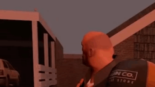 A Man With A Beard Is Standing In Front Of A Building With The Word Bird Written On It . GIF