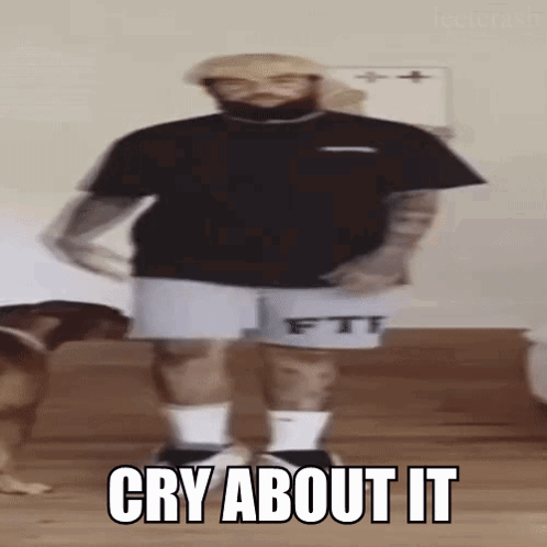 A Man With A Beard Is Standing In Front Of A Dog And Says `` Cry About It '' While Dancing . GIF