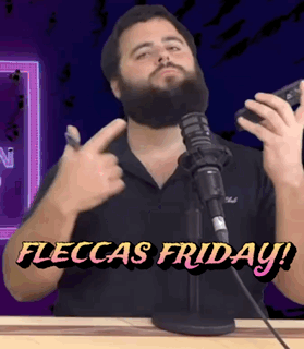 A Man With A Beard Is Standing In Front Of A Microphone With The Words " Fleckas Friday " On The Bottom GIF