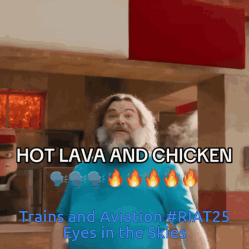 A Man With A Beard Is Standing In Front Of A Sign That Says Hot Lava And Chicken GIF