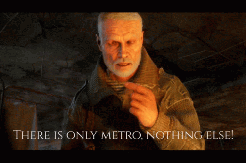 A Man With A Beard Is Standing In Front Of A Sign That Says " There Is Only Metro Nothing Else " GIF