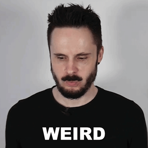 Man With Beard Standing In Front Of Weird Background GIF