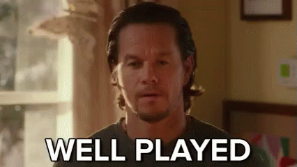 A Man With A Beard Is Standing In Front Of A Window And Says `` Well Played '' . GIF