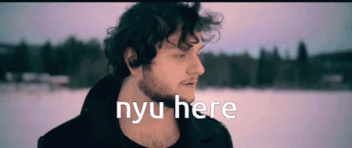 A Man With A Beard Is Standing In The Snow With Nyu Here Written On The Screen GIF