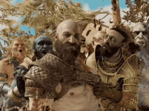 A Man With A Beard Is Surrounded By A Group Of People GIF