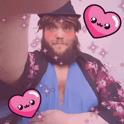 A Man With A Beard Is Surrounded By Pink Hearts With The Letters Owo On Them GIF