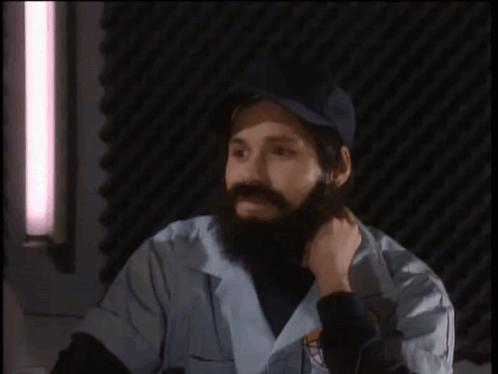 A Man With A Beard Is Talking About The Earth GIF