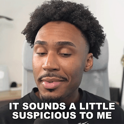 A Man With A Beard Is Talking Into A Microphone And Says It Sounds A Little Suspicious To Me GIF