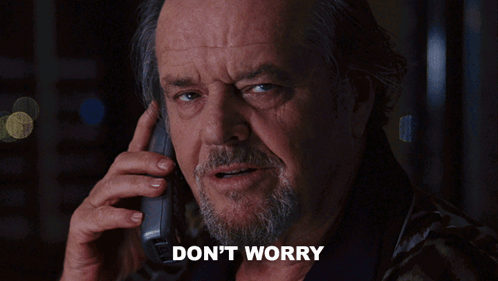 A Man With A Beard Is Talking On A Cell Phone With The Words " Don 'T Worry " Written Below Him GIF