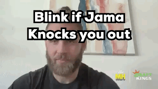 A Man With A Beard Is Talking On A Video Call With The Words `` Blink If Jama Knocks You Out '' Above Him . GIF