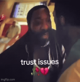 A Man With A Beard Is Talking To Another Man And The Words Trust Issues Are On The Screen GIF