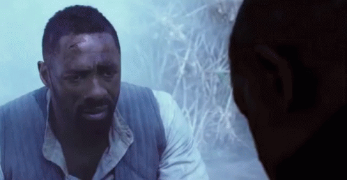 A Man With A Beard Is Talking To Another Man . GIF