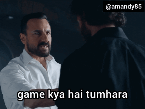 A Man With A Beard Is Talking To Another Man With The Words Game Kya Hai Tumhara Above Him GIF