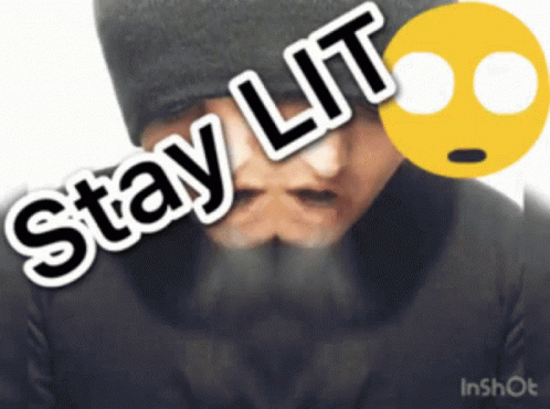 A Man With A Beard Is Wearing A Black Hat And Has The Words Stay Lit On His Face GIF