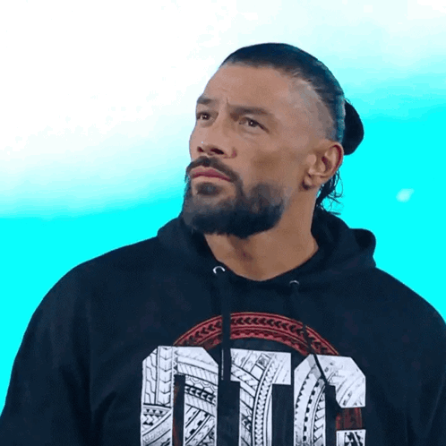 A Man With A Beard Is Wearing A Black Hoodie With The Word Ote On It GIF