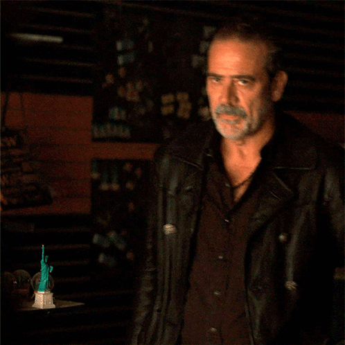 A Man With A Beard Is Wearing A Black Jacket GIF