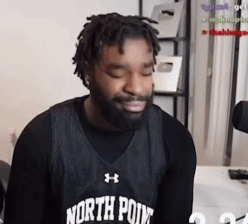 A Man With A Beard Is Wearing A Black North Point Jersey GIF