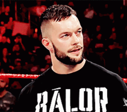 A Man With A Beard Is Wearing A Black Shirt That Says ' Halor ' On It GIF