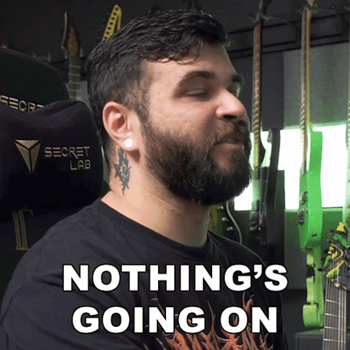 A Man With A Beard Is Wearing A Black Shirt That Says Nothing 'S Going On GIF