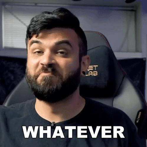 A Man With A Beard Is Wearing A Black Shirt That Says Whatever On It GIF