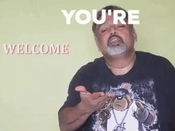 A Man With A Beard Is Wearing A Black Shirt With A Picture Of A Bear On It . GIF