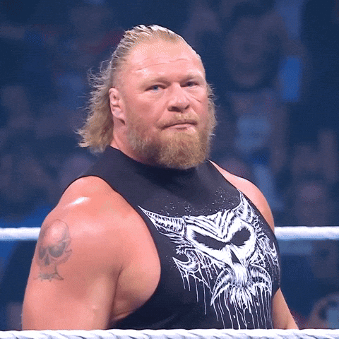 A Man With A Beard Is Wearing A Black Tank Top With A White Skull On It GIF