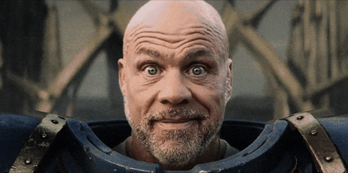 A Man With A Beard Is Wearing A Blue Armor GIF
