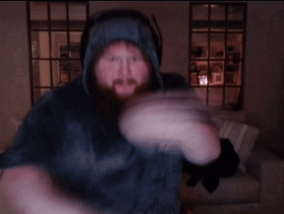 A Man With A Beard Is Wearing A Blue Hoodie GIF