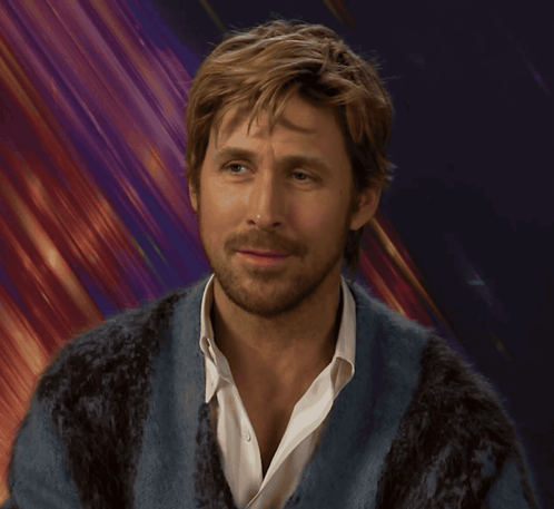 A Man With A Beard Is Wearing A Blue Sweater And A White Shirt GIF