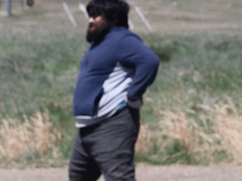 A Man With A Beard Is Wearing A Blue Sweatshirt GIF