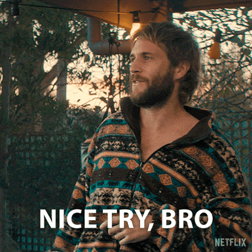 A Man With A Beard Is Wearing A Colorful Jacket And Says Nice Try Bro GIF