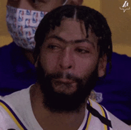A Man With A Beard Is Wearing A Face Mask GIF