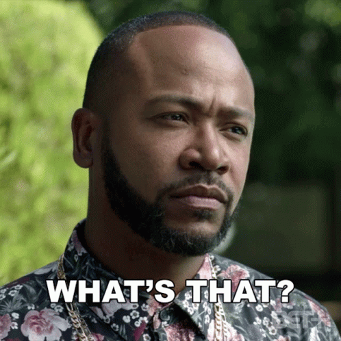 A Man With A Beard Is Wearing A Floral Shirt And Says What 'S That GIF