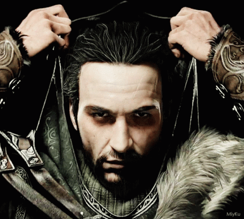 Man With Beard Holding Hair In Fur Coat GIF