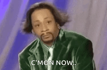 A Man With A Beard Is Wearing A Green Jacket And Tie And Is Saying `` C Mon Now '' . GIF