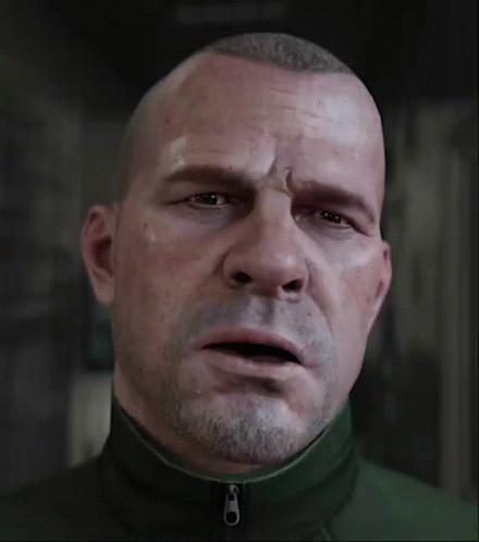 A Man With A Beard Is Wearing A Green Jacket With A Zipper On The Front GIF
