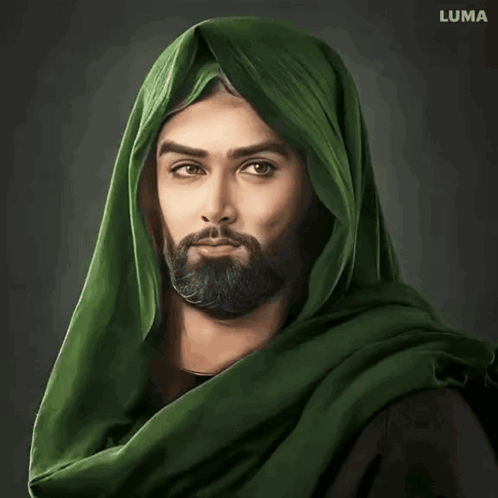 A Man With A Beard Is Wearing A Green Scarf And Holding A Piece Of Paper GIF
