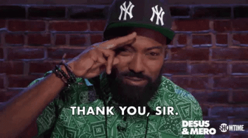 A Man With A Beard Is Wearing A Green Shirt And A Green Hat And Saying `` Thank You , Sir '' . GIF