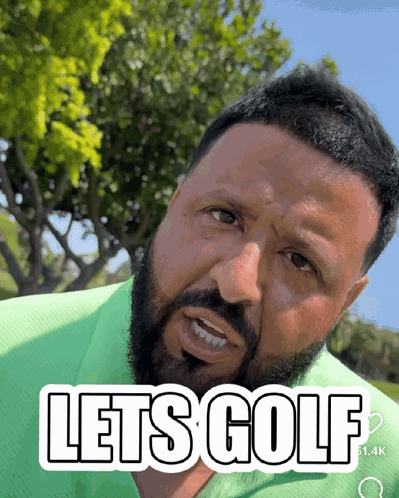 A Man With A Beard Is Wearing A Green Shirt That Says Lets Golf GIF