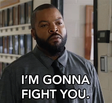 A Man With A Beard Is Wearing A Grey Shirt And Tie And Says I 'M Gonna Fight You . GIF