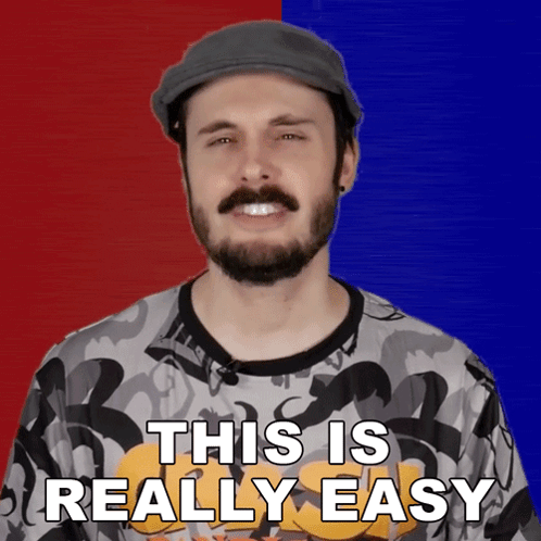 A Man With A Beard Is Wearing A Hat And A Shirt That Says This Is Really Easy GIF