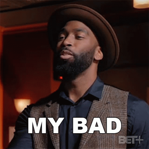 A Man With A Beard Is Wearing A Hat And A Vest And Says `` My Bad '' . GIF