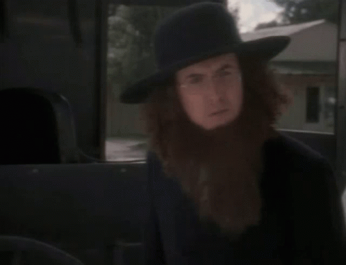 A Man With A Beard Is Wearing A Hat GIF