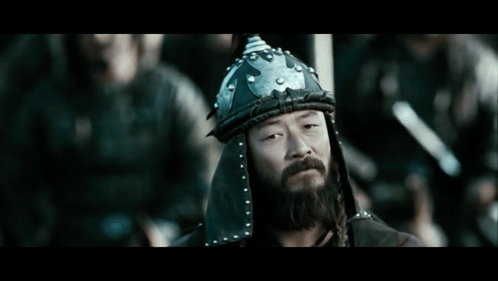 A Man With A Beard Is Wearing A Helmet GIF