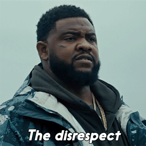 A Man With A Beard Is Wearing A Jacket That Says The Disrespect On It GIF